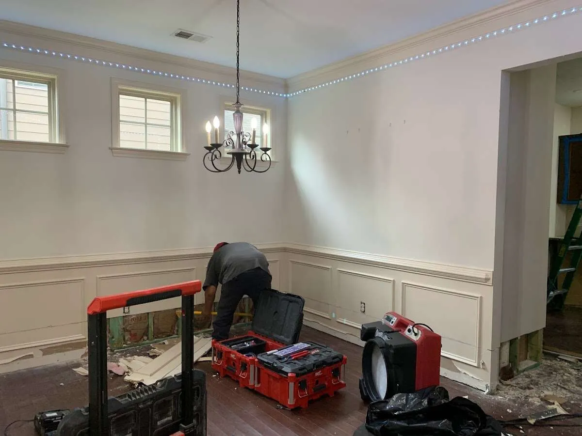 Restoration technician with professional equipment in Brambleton